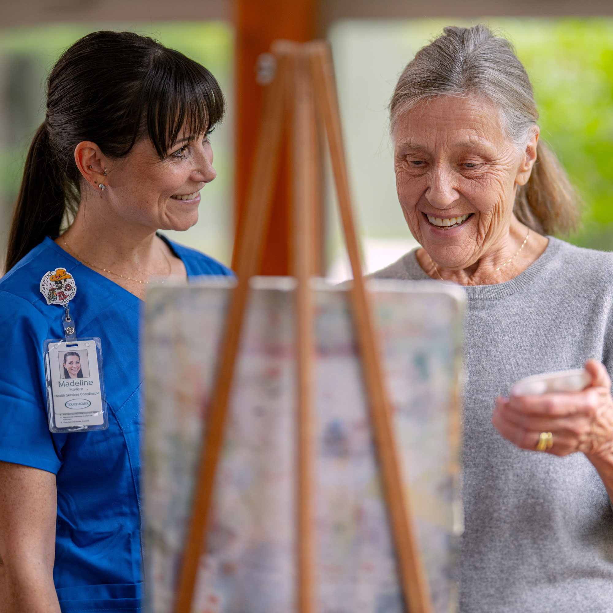 Team member painting with a resident